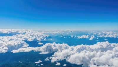 monochrome,outdoors,sky,day,cloud,blue sky,no humans,ocean,cloudy sky,nature,scenery,blue theme,mountain,horizon,landscape,above clouds,water,island