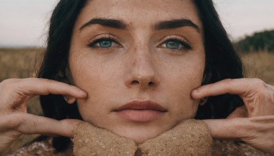 1girl,solo,long hair,looking at viewer,blue eyes,black hair,jewelry,closed mouth,green eyes,earrings,blurry,lips,eyelashes,depth of field,blurry background,thick eyebrows,portrait,close-up,freckles,realistic,nose,pinching,cheek pinching,short hair,expressionless,head rest