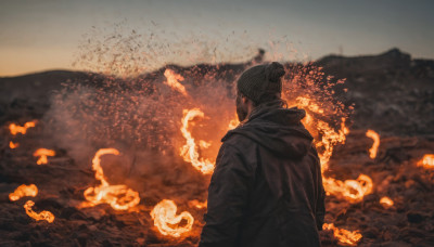 solo, 1boy, hat, upper body, male focus, outdoors, sky, hood, from behind, blurry, coat, hood down, fire, scenery, mountain, beanie, facing away, burning