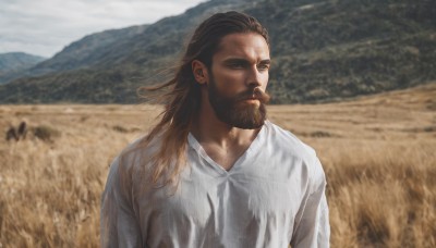 solo,long hair,brown hair,shirt,1boy,brown eyes,closed mouth,white shirt,upper body,male focus,outdoors,day,medium hair,blurry,looking to the side,blurry background,facial hair,beard,mountain,realistic,manly,field,sky,depth of field,looking away,sunlight,looking afar