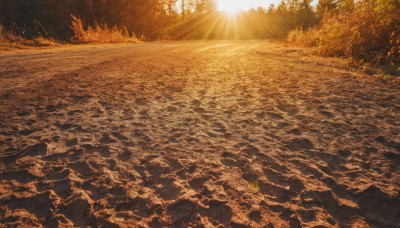 outdoors,sky,day,water,tree,no humans,sunlight,grass,nature,scenery,forest,sunset,light rays,rock,sun,river,landscape,orange theme,beach,mountain,sand,road,sunbeam,shore