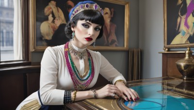 1girl,solo,breasts,looking at viewer,short hair,bangs,black hair,long sleeves,hat,dress,jewelry,earrings,parted lips,indoors,blunt bangs,necklace,hair bun,nail polish,white dress,black eyes,bracelet,lips,grey eyes,window,makeup,table,single hair bun,ring,lipstick,gem,red nails,reflection,beads,red lips,bead necklace,gold,pearl necklace,painting (object),sitting,upper body,tiara,realistic