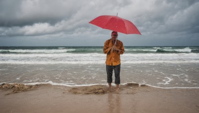 solo,short hair,shirt,long sleeves,1boy,holding,standing,male focus,red hair,outdoors,sky,barefoot,collared shirt,pants,cloud,water,facial hair,ocean,umbrella,beach,black pants,cloudy sky,rain,holding umbrella,sand,wide shot,waves,grey sky,red umbrella,black hair,hat,day,horizon