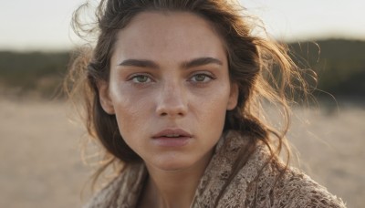 1girl,solo,long hair,looking at viewer,brown hair,brown eyes,outdoors,parted lips,teeth,day,blurry,lips,floating hair,depth of field,blurry background,thick eyebrows,wind,messy hair,portrait,freckles,realistic,nose,black hair,close-up,dirty,desert