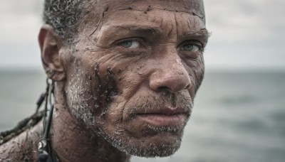 solo,looking at viewer,1boy,jewelry,closed mouth,male focus,earrings,outdoors,blurry,grey eyes,blurry background,facial hair,portrait,beard,realistic,bald,old,blue eyes,grey hair,tattoo,close-up,mustache,very short hair,manly