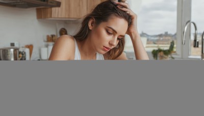 1girl,solo,long hair,breasts,brown hair,shirt,brown eyes,closed mouth,white shirt,upper body,sleeveless,indoors,medium hair,blurry,lips,window,sleeveless shirt,blurry background,looking down,table,tank top,freckles,realistic,hand on own head,white tank top,sink,black hair,holding,bare shoulders,mole,bottle,hand in own hair,kitchen