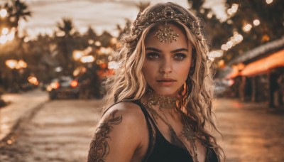 1girl,solo,long hair,breasts,looking at viewer,blonde hair,hair ornament,cleavage,bare shoulders,brown eyes,jewelry,closed mouth,upper body,earrings,outdoors,choker,dark skin,necklace,blurry,dark-skinned female,lips,tattoo,depth of field,blurry background,wavy hair,tank top,freckles,realistic,nose,arm tattoo,shoulder tattoo,dress,medium breasts,sleeveless,black dress,thick eyebrows,tiara,portrait,christmas tree,bokeh