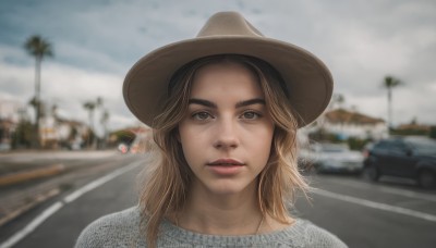 1girl,solo,long hair,looking at viewer,blonde hair,brown hair,shirt,hat,brown eyes,white shirt,outdoors,parted lips,sky,day,cloud,medium hair,blurry,tree,lips,depth of field,blurry background,cloudy sky,ground vehicle,portrait,motor vehicle,freckles,realistic,nose,car,road,street,photo background,grey sky,jewelry,teeth,necklace,thick eyebrows