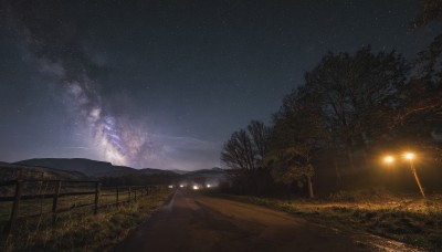 outdoors,sky,cloud,tree,no humans,night,grass,star (sky),night sky,scenery,starry sky,fence,road,lamppost,path,milky way,ground vehicle,motor vehicle,mountain,dark,field,landscape