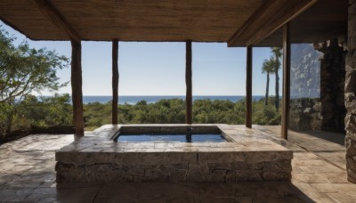 outdoors,sky,day,cloud,water,tree,blue sky,no humans,ocean,beach,nature,scenery,rock,mountain,wall,pillar,plant,horizon,landscape