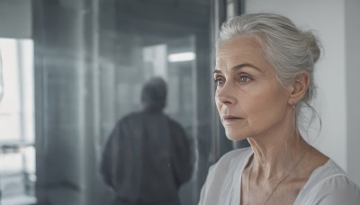 1girl,short hair,blue eyes,shirt,1boy,jewelry,closed mouth,white shirt,upper body,white hair,grey hair,solo focus,indoors,necklace,hair bun,blurry,lips,blurry background,single hair bun,realistic,old,old woman,earrings,grey eyes,depth of field,scar,portrait,robe,wrinkled skin