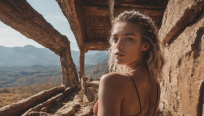 1girl,solo,long hair,breasts,looking at viewer,blue eyes,blonde hair,brown hair,bare shoulders,upper body,outdoors,parted lips,day,looking back,medium hair,from behind,lips,back,mountain,realistic,open mouth,brown eyes,medium breasts,sky,teeth,water,blurry,ocean